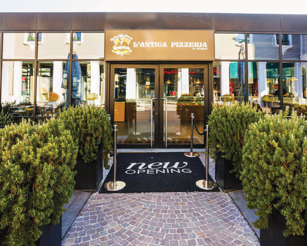 Interno pizzeria moderna IMAGO | Arredi su misura per Food Retail
